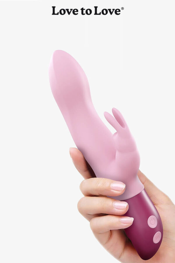 Vibromasseur Rabbit Hello Rabbit de la marque Love to Love dans une main