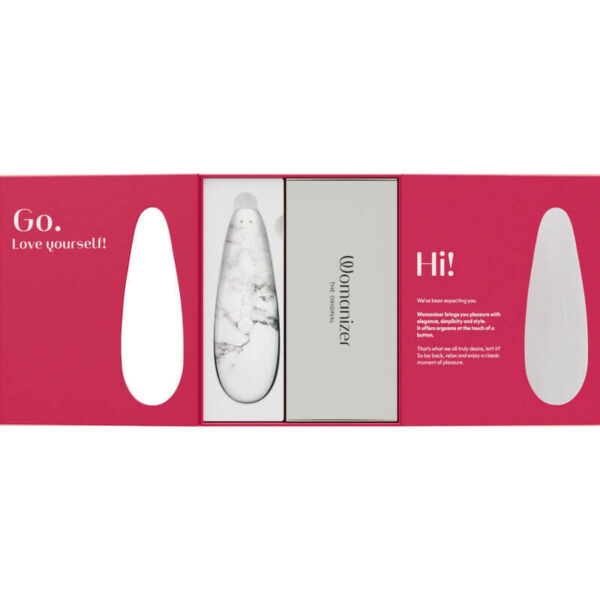 Packaging du stimulateur clitoridien Classic 2 Marilyn Monroe marbre blanc de la marque Womanizer