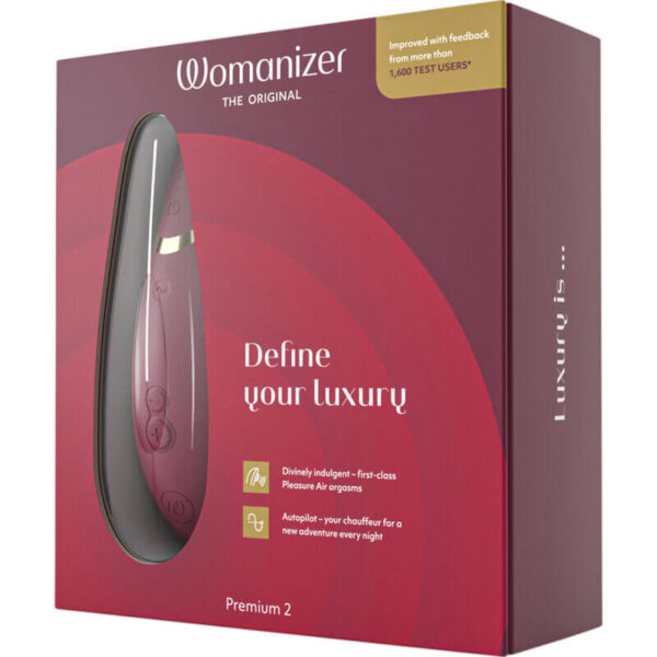 Packaging du stimulateur clitoridien Premium 2 bordeaux de la marque Womanizer